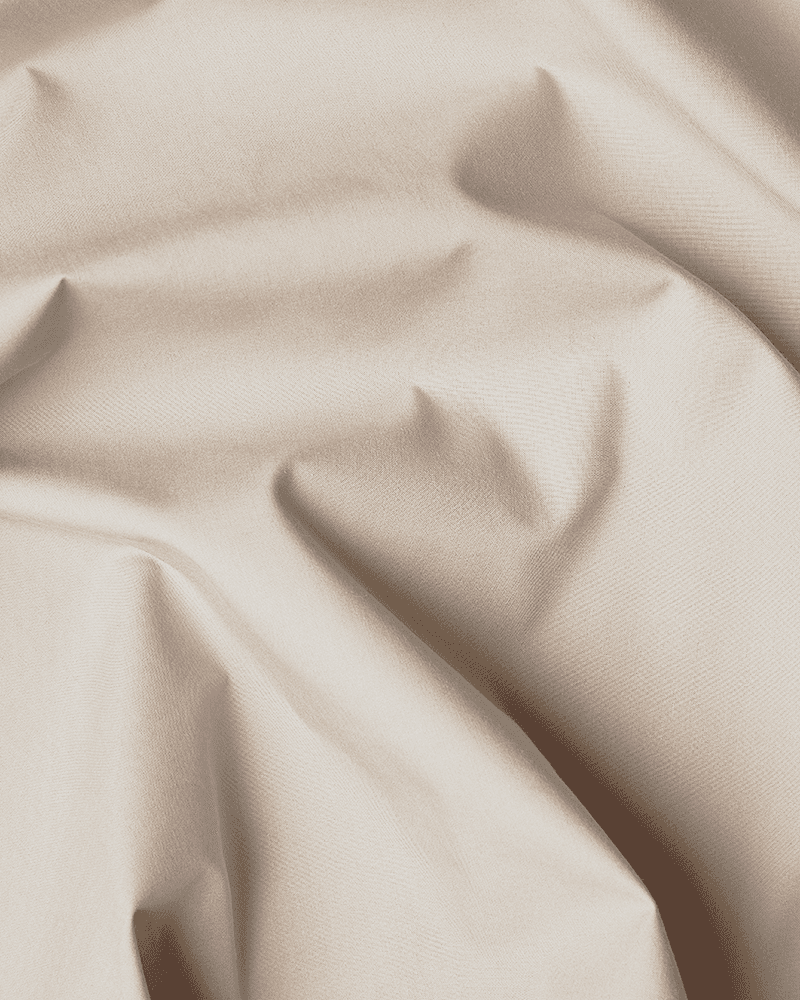 Primo piano del cotone beige certificato OEKO-TEX® utilizzato per il giroletto da letto